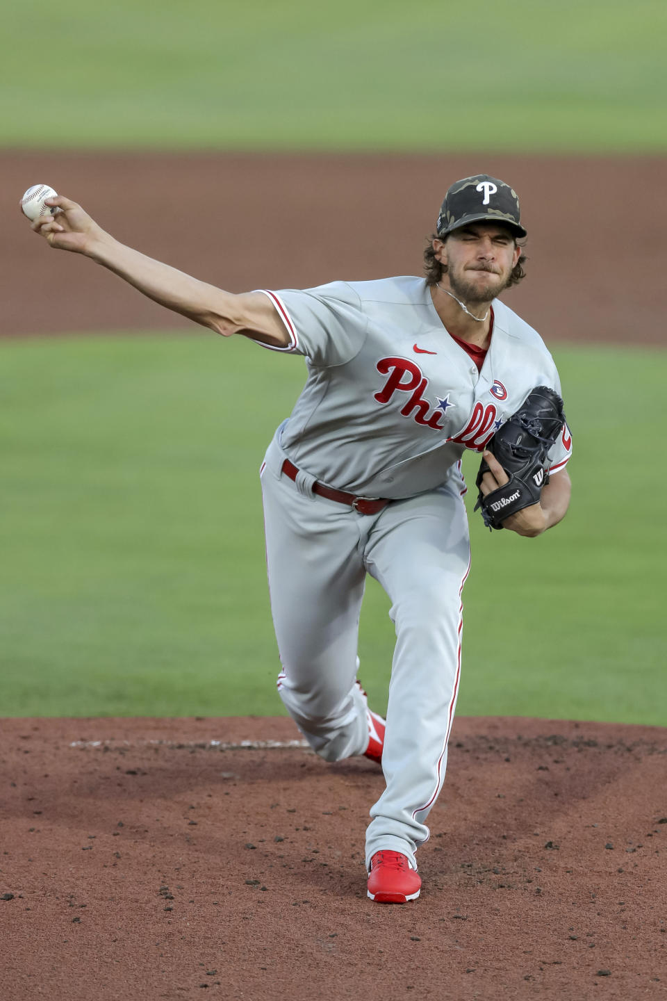Philadelphia Phillies starting pitcher Aaron Nola throws against the Toronto Blue Jays during the first inning of a baseball game Saturday, May 15, 2021, in Dunedin, Fla. (AP Photo/Mike Carlson)