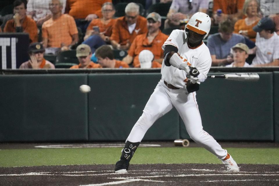 Texas outfielder Porter Brown (4) bats during the home game against LSU Tuesday, Feb. 28, 2023. 