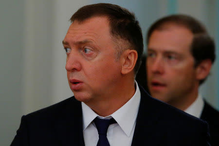 FILE PHOTO: Russian aluminium tycoon Oleg Deripaska and Industry and Trade Minister Denis Manturov arrive for the talks of Russian President Vladimir Putin with South Korean President Moon Jae-in at the Kremlin in Moscow, Russia June 22, 2018. REUTERS/Sergei Karpukhin