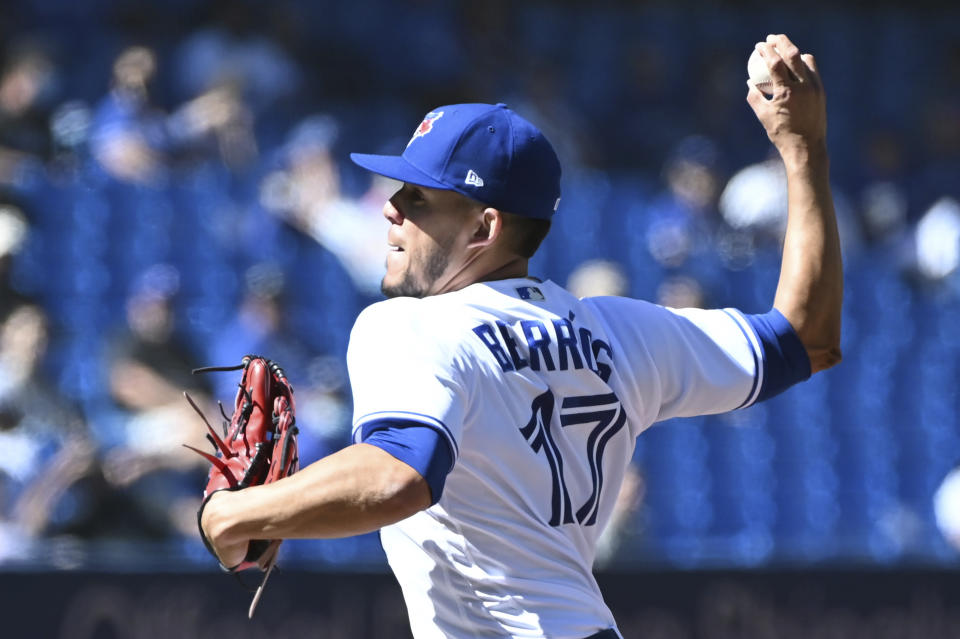 Toronto Blue Jays starting pitcher Jose Berrios pitches in the first inning of a baseball game against the Minnesota Twins in Toronto on Sunday, Sept. 19, 2021. (Jon Blacker/The Canadian Press via AP)