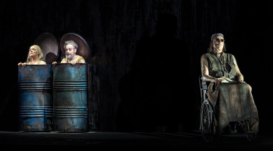 In this photo taken on Nov. 11, 2018, from left, Hilary Sanders, Leonardo Cortellazzi and Frode Olsen perform during rehearsals of Gyoergy Kurtag's opera 'Fin de Partie' at the Milan La Scala opera house, Italy. The long-awaited premiere of composer Georgy Kurtag's first-ever opera at Milan's La Scala opera house, based on a Beckett play, ''Fin de Partie'' is being billed as the most important opera premiere of the last 50 years and it is scheduled to go on stage Thursday, Nov. 15, 2018. (Ruth Walz via AP)