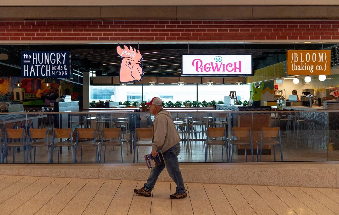 A man walks by a food court in concourse A at the new Kansas City International Airport terminal Feb. 18 in Kansas City.