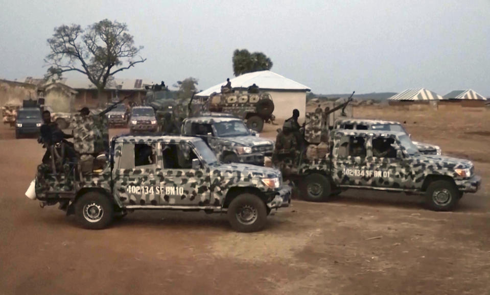 In this screen grab taken from video, Nigerian Army vehicles are parked at the village were children were kidnapped in Kuriga, Kaduna State, Thursday, March. 7, 2024. Gunmen attacked a school in Nigeria's northwest region Thursday morning and abducted at least 287 students, the headteacher told authorities, marking the second mass abduction in the West African nation in less than a week. (AP Video)