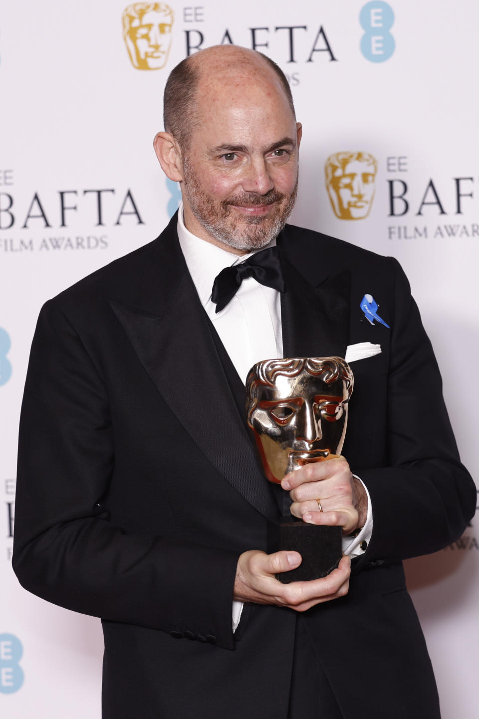 Edward Berger poses for photographers with the Director Award for the film 'All Quiet on the Western Front' at the 76th British Academy Film Awards, BAFTA's, in London, Sunday, Feb. 19, 2023 (Photo by Vianney Le Caer/Invision/AP)