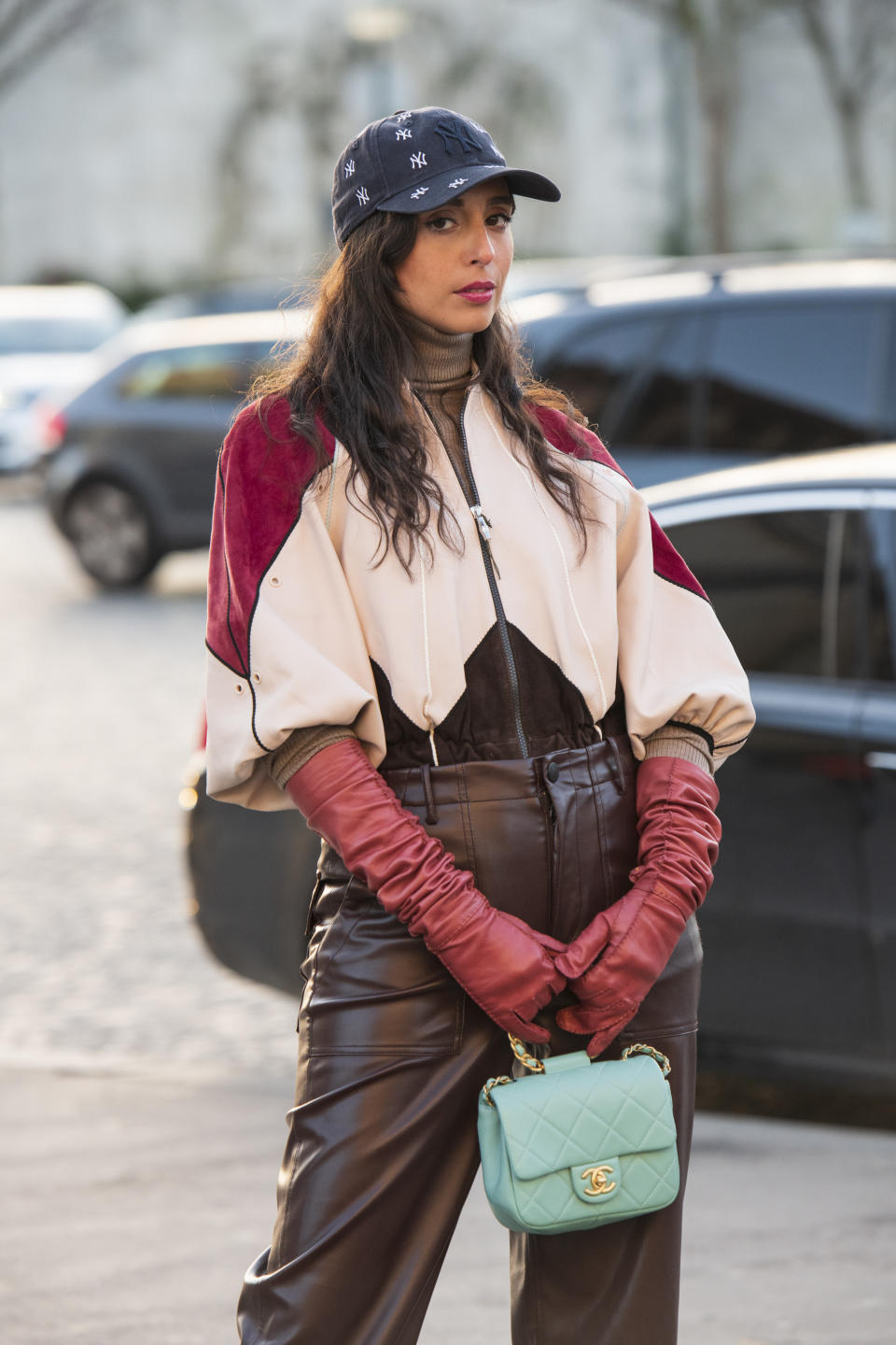 PARIS, FRANCE - FEBRUARY 26: Digital influencer Gabriella Berdugo wears a New York Yankee's baseball cap, Chanel bag, Prada gloves, Lacoste trousers and jacket on February 26, 2020 in Paris, France. (Photo by Kirstin Sinclair/Getty Images)