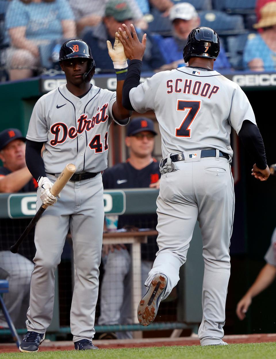 Jonathan Schoop of the Detroit Tigers is congratulated by Daz Cameron after scoring during the 1st inning of the game against the Kansas City Royals at Kauffman Stadium in Kansas City, Missouri, on Tuesday, June 15, 2021.