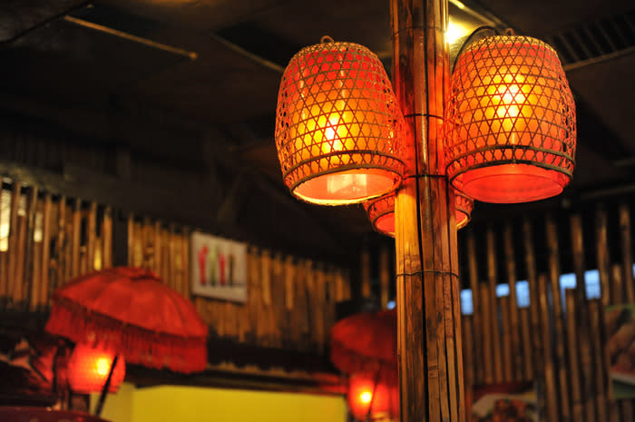 Attractive place: The stall at Rumah Iga 7 Jari has an attractive interior, including lampshades made from plaited bamboo rooster cages. (