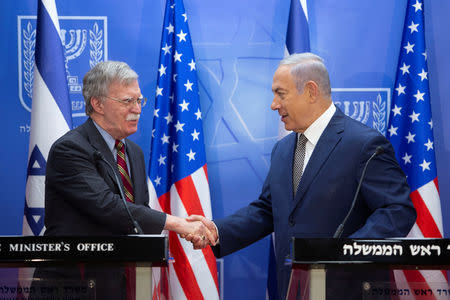Israeli Prime Minister Benjamin Netanyahu shake hands with U.S. National Security Adviser John Bolton during their meeting at the Prime Minister's office in Jerusalem August 20, 2018. Sebastian Scheiner /Pool via Reuters *** Local Caption ***