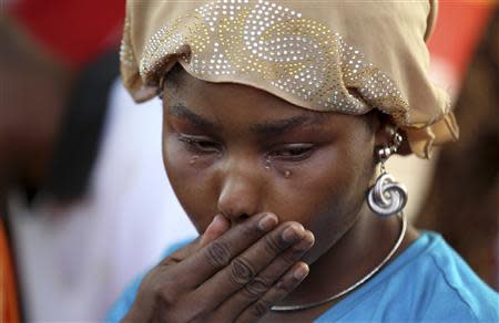 A protester cries during a sit-in rally for the abducted schoolgirls, at the Unity Fountain in Abuja May 15, 2014. REUTERS/Afolabi Sotunde