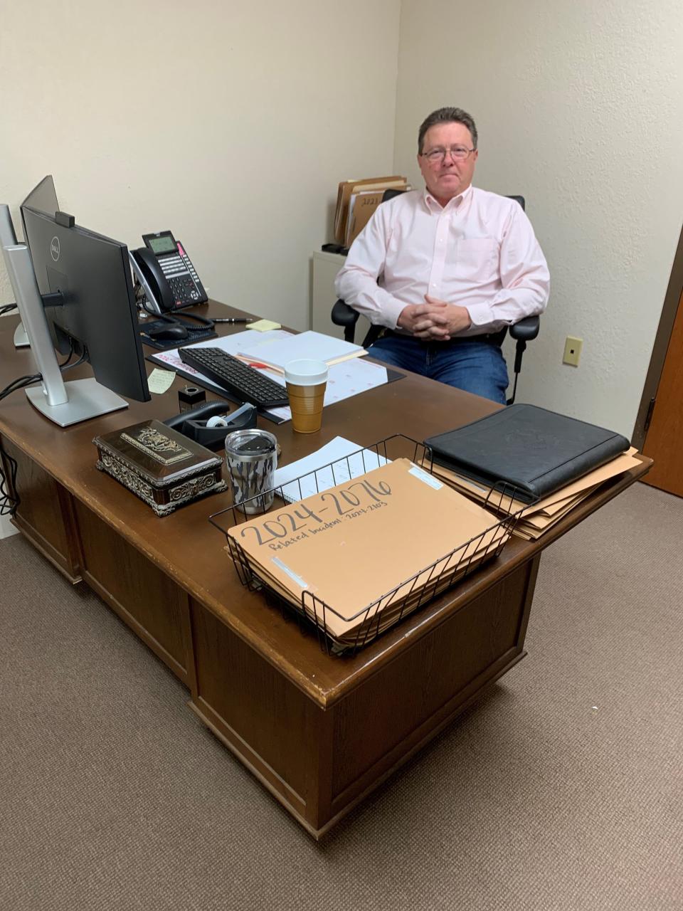 Jeff Bell, retired Abilene police investigator, sits at his desk in the Taylor County Sheriff's Office. He is a detective for the sheriff's Criminal Investigations Division.