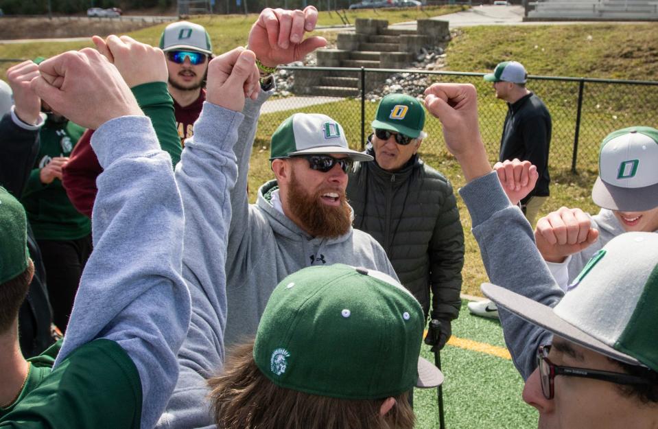 Oakmont baseball coach Tim Caouette gathers the team on the first day of practice on Monday.