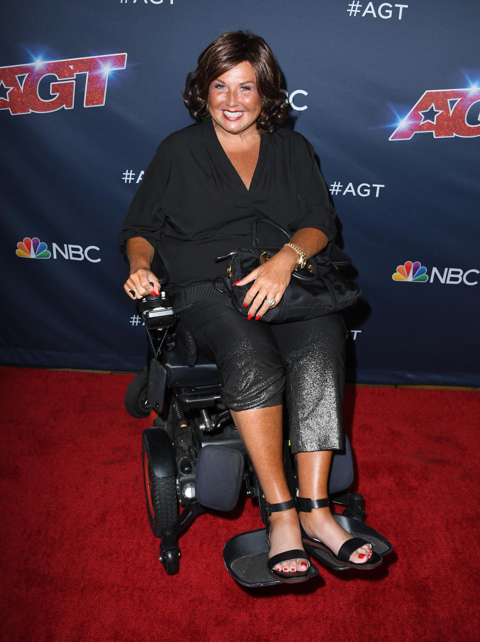 A photo of Abby Lee Miller using a wheelchair on the red carpet at the America's Got Talent" Season 14 Live Show Red Carpet at Dolby Theatre on September 03, 2019 in Hollywood, California.