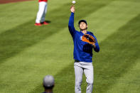 Los Angeles Dodgers' Shohei Ohtani throws before a baseball game against the Washington Nationals at Nationals Park, Tuesday, April 23, 2024, in Washington. (AP Photo/Alex Brandon)