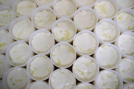 Molds with curd are seen at the French non-pasteurized Camembert cheese farm ''Le 5 Freres de Bermonville" in Bermonville, France, March 12, 2019. Picture taken March 12, 2019. REUTERS/Gonzalo Fuentes