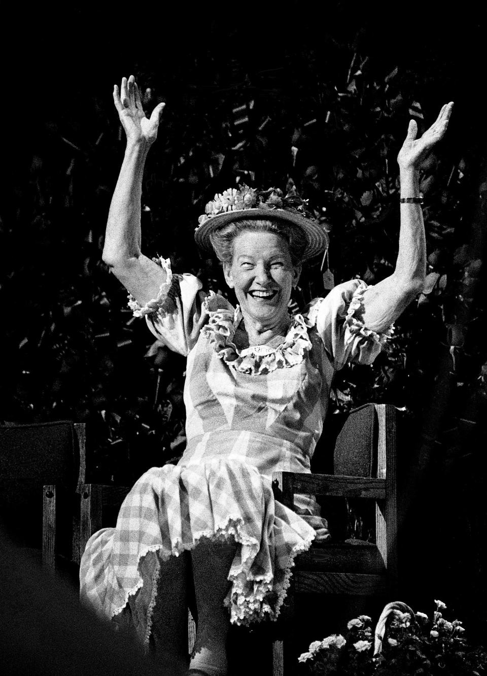 Minnie Pearl, the “Grand Lady of the Grand Ole Opry,” raises her arms after hearing praise from one of her old friends during a tribute to her 50 years on the Opry during an hour-long televised special at the Opry House Nov. 3, 1990.