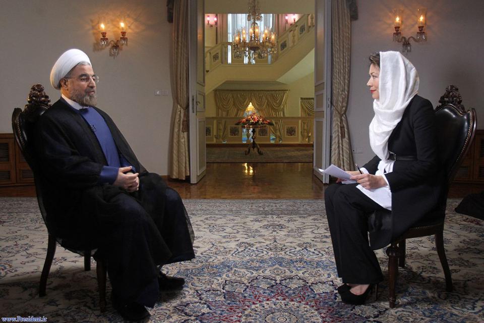 Iranian President Hassan Rouhani speaks during an interview with Ann Curry (R) from the U.S. television network NBC in Tehran, in this picture taken September 18, 2013, and provided by the Iranian Presidency. Rouhani said in the television interview with NBC News on Wednesday that his government would never develop nuclear weapons and that he had "complete authority" to negotiate a nuclear deal with the West. REUTERS/President.ir/Handout via Reuters (IRAN - Tags: POLITICS MEDIA) ATTENTION EDITORS � THIS IMAGE WAS PROVIDED BY A THIRD PARTY. NO SALES. NO ARCHIVES. FOR EDITORIAL USE ONLY. NOT FOR SALE FOR MARKETING OR ADVERTISING CAMPAIGNS. THIS PICTURE IS DISTRIBUTED EXACTLY AS RECEIVED BY REUTERS, AS A SERVICE TO CLIENTS