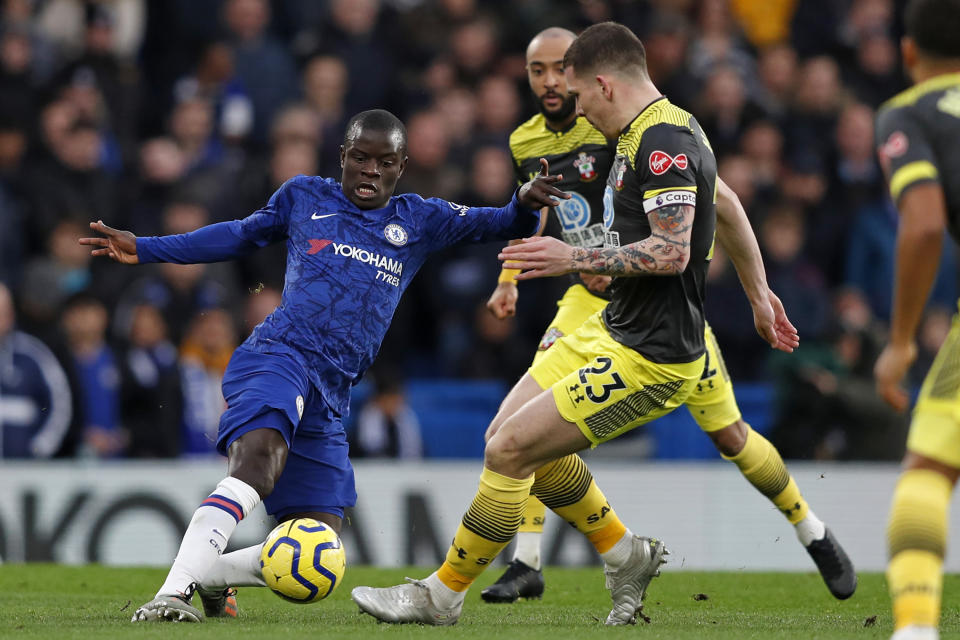 Chelsea's French midfielder N'Golo Kante (L) vies with Southampton's Danish midfielder Pierre-Emile Hojbjerg during the English Premier League football match between Chelsea and Southampton at Stamford Bridge in London on December 26, 2019. (Photo by Adrian DENNIS / AFP) / RESTRICTED TO EDITORIAL USE. No use with unauthorized audio, video, data, fixture lists, club/league logos or 'live' services. Online in-match use limited to 120 images. An additional 40 images may be used in extra time. No video emulation. Social media in-match use limited to 120 images. An additional 40 images may be used in extra time. No use in betting publications, games or single club/league/player publications. /  (Photo by ADRIAN DENNIS/AFP via Getty Images)