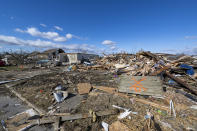 Damage from a late-night tornado is seen in Sullivan, Ind., Saturday, April 1, 2023. Multiple deaths were reported in the area following the storm. (AP Photo/Doug McSchooler)