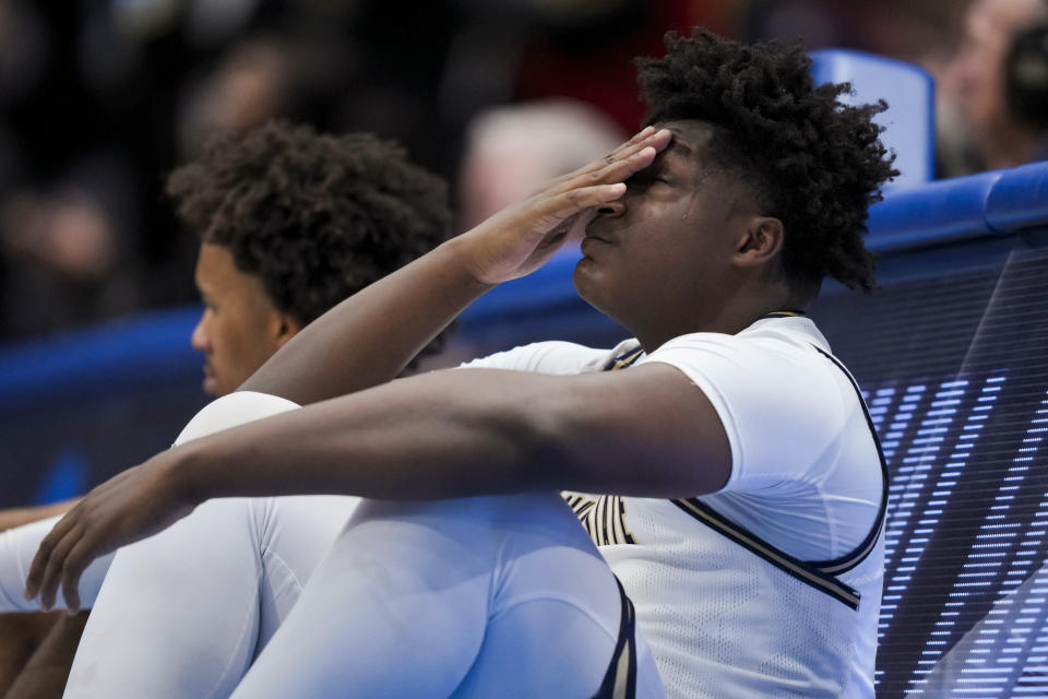 Grambling State guard Zahad Munford wipes his face as he sits near the sideline during the second half of the team's First Four game against Montana State in the NCAA men's college basketball tournament Wednesday, March 20, 2024, in Dayton, Ohio. (AP Photo/Aaron Doster)