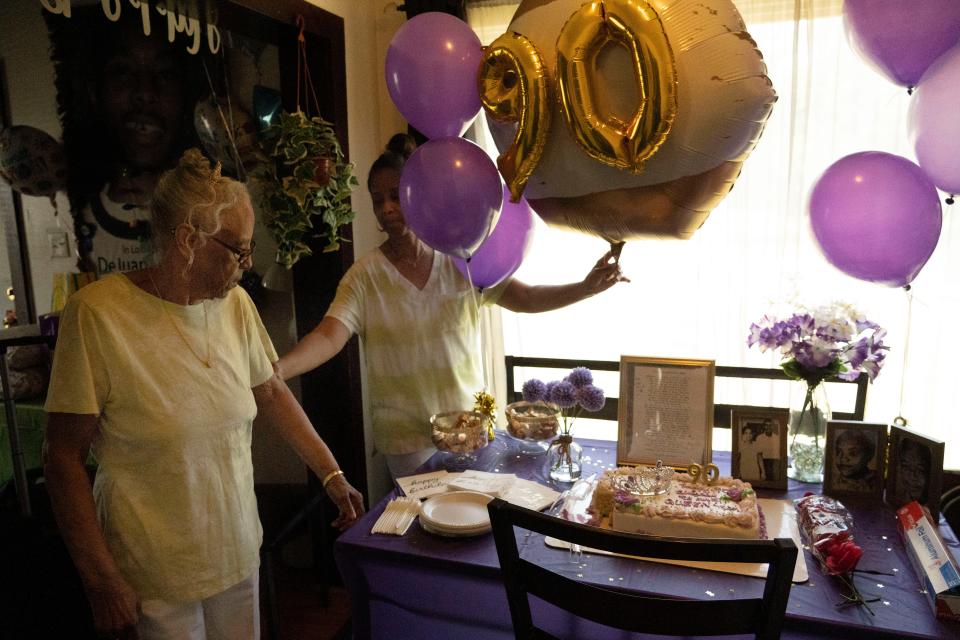 Ellen Cavanaugh, 63, shows her Mother Esther Williams her birthday cake on her 90th birthday celebration on Wednesday, June 22, 2022, in Indianapolis. 