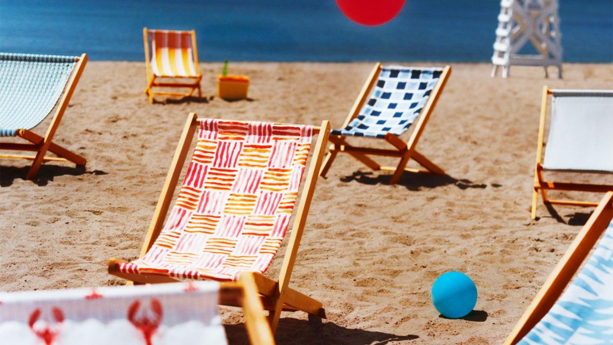 a table and chairs on a beach