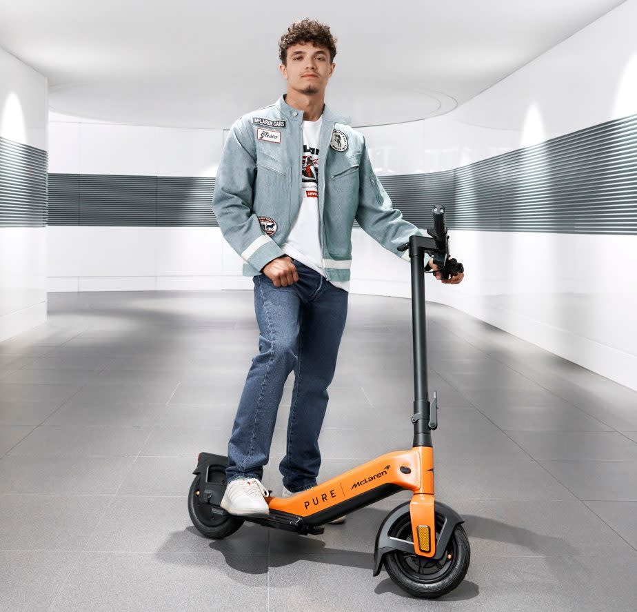 Norris pictured at the McClaren Technology Centre, with a slightly less powerful vehicle (a combination between McClaren and electric scooter brand Pure)