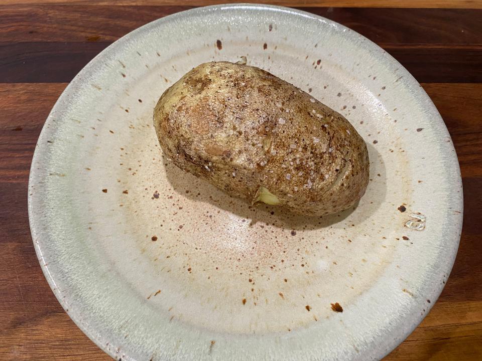 microwaved potato on a kitchen plate