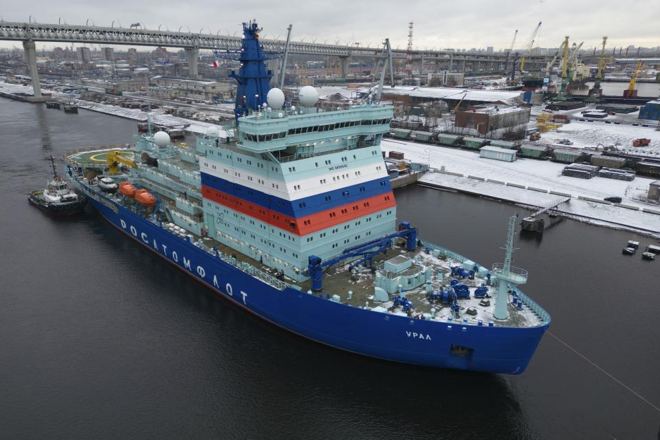 FILE - Newly built nuclear-powered icebreaker Ural, third of five icebreakers of Project 22220, begins its passage from the Baltiysky Shipyard to the northern city of Murmansk, in St. Petersburg, Russia, on Nov. 23, 2022. After a year of far-reaching sanctions aimed at degrading Moscow's war chest, economic life for ordinary Russians doesn't look all that different than it did before the invasion of Ukraine. But with restrictions finally tightening on the Kremlin's chief moneymaker — oil — the months ahead will be an even tougher test of President Vladimir Putin's fortress economy. (AP Photo/Dmitri Lovetsky, File)