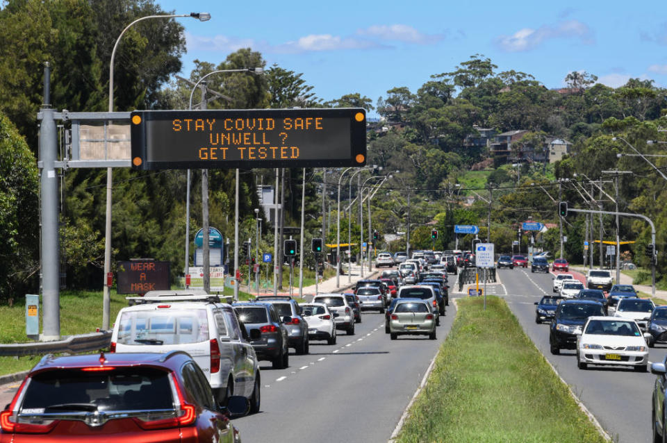 Traffic heading towards the city are warned about Covid-19 on digital displays at North Narrabeen in Sydney.