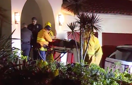 The rapper is shown being removed from the home on a stretcher. Source: RMG News via TMZ