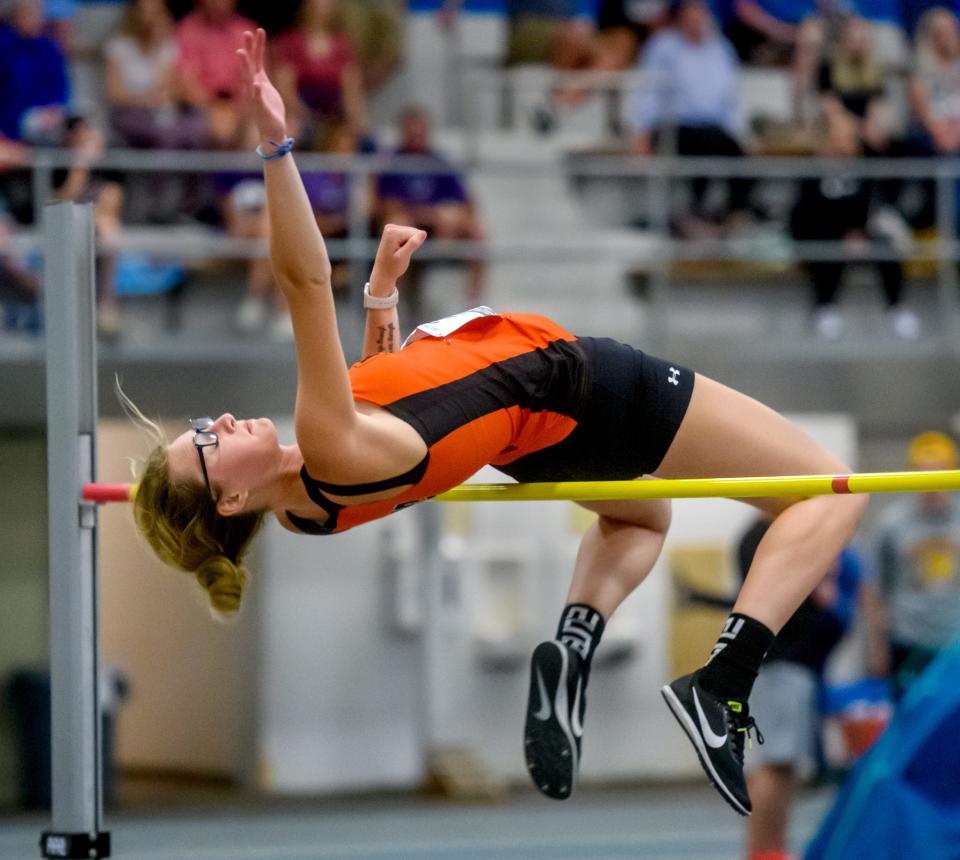 Hillsboro's Kaci Papin clears the bar in the high jump during the Class 1A State Track and Field Championships on Saturday, May 21, 2022 at Eastern Illinois University. All the field events except discus and shot put were moved in to the fieldhouse next door to O'Brien Stadium because of rainy weather.