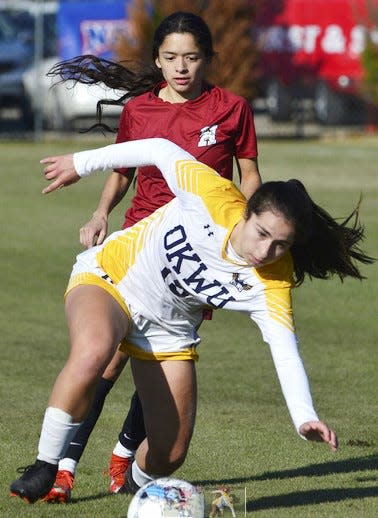 Oklahoma Wesleyan University;'s Martina Cordova, right, cuts off a Hastings (Neb.) defender during NAIA regional women's soccer play on Nov. 17, 2022, in Bartlesville. OKWU won, 5-0.