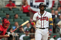 Atlanta Braves' Ronald Acuna Jr. tosses his bat as he walks to first on a walk during the second inning of a baseball game against the St. Louis Cardinals, Monday, July 4, 2022, in Atlanta. (AP Photo/Butch Dill)