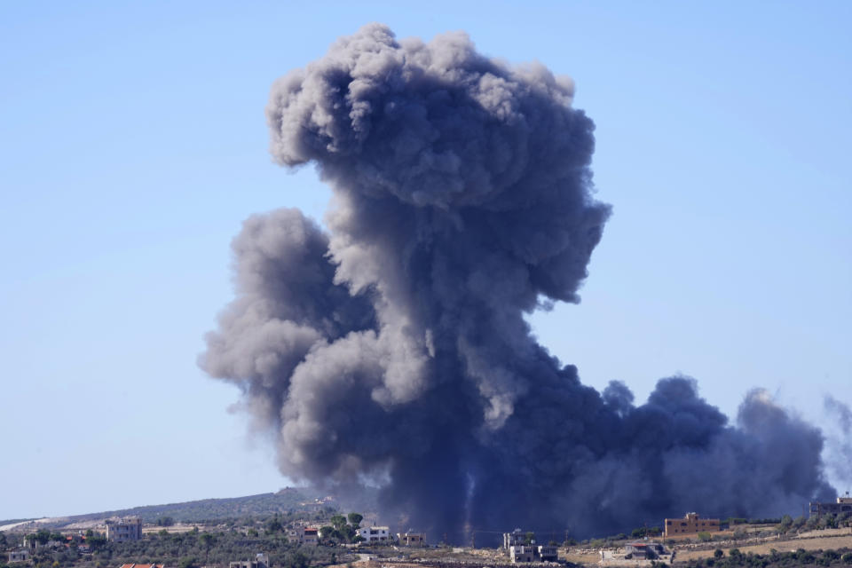 Black smoke rises from an Israeli airstrike on the outskirts of Aita al-Shaab, a Lebanese border village with Israel in south Lebanon, Saturday, Nov. 4, 2023. The Lebanon-Israel border has been the site of regular clashes between Israeli forces on one side and Hezbollah and Palestinian armed groups on the other since the beginning of the Israel-Hamas war. (AP Photo/Hussein Malla)