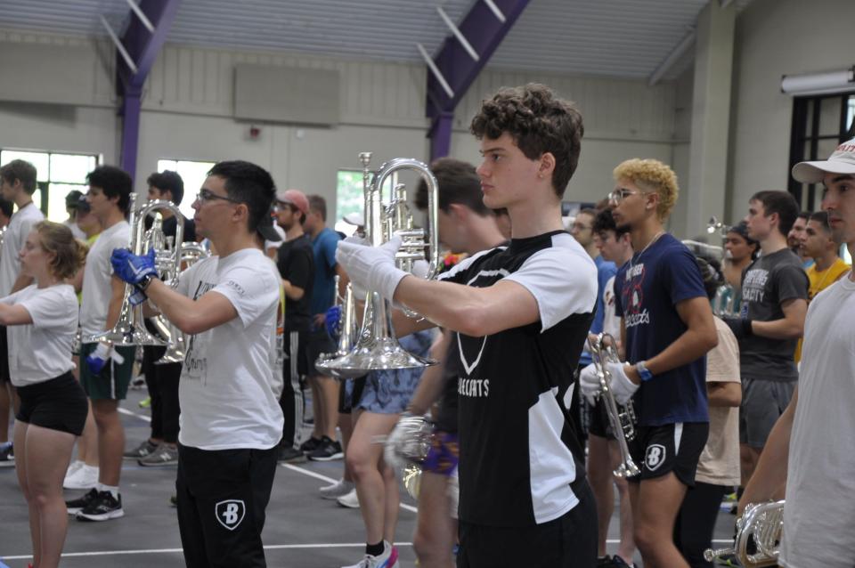 Andrew Himelstein of West Chester, O., and other Bluecoats members for the brass and battery unit practice their cadence inside the Peterson Field House on May 26, 2023, at the University of Mount Union in Alliance.