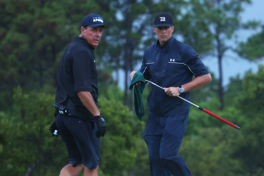 HOBE SOUND, FLORIDA - MAY 24: Phil Mickelson reads a putt for NFL player Tom Brady.