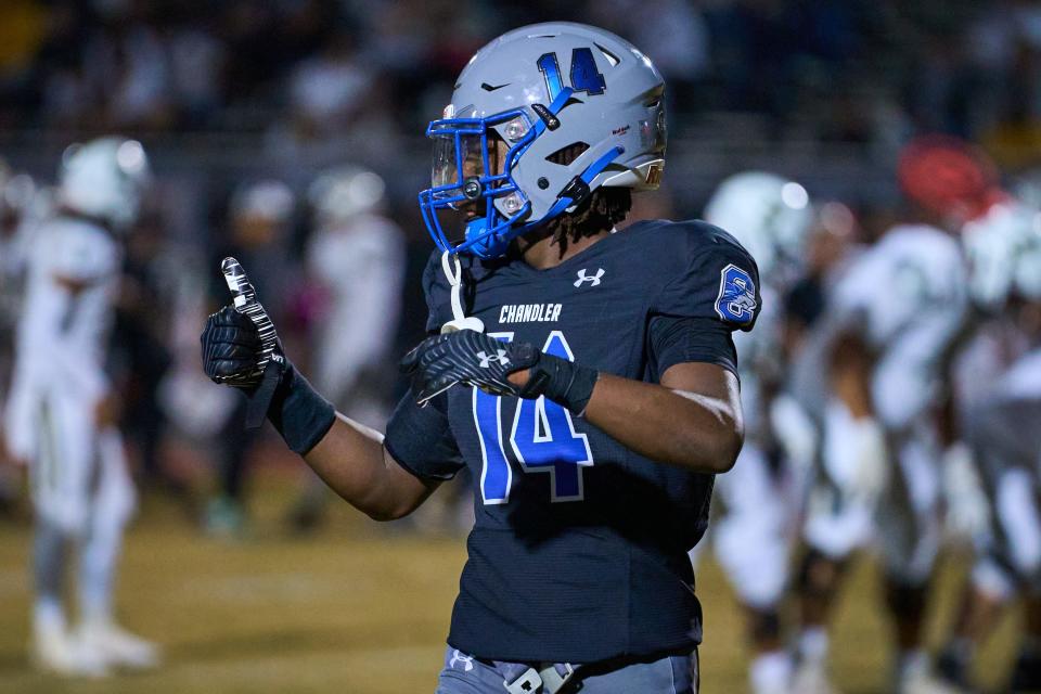 Chandler Wolves corner back Sammie Hunter (14) looks for the thumbs up from his sideline before lining up on the line of scrimmage against the Basha Bears at Austin Field in Chandler on Friday, Oct. 28, 2022.