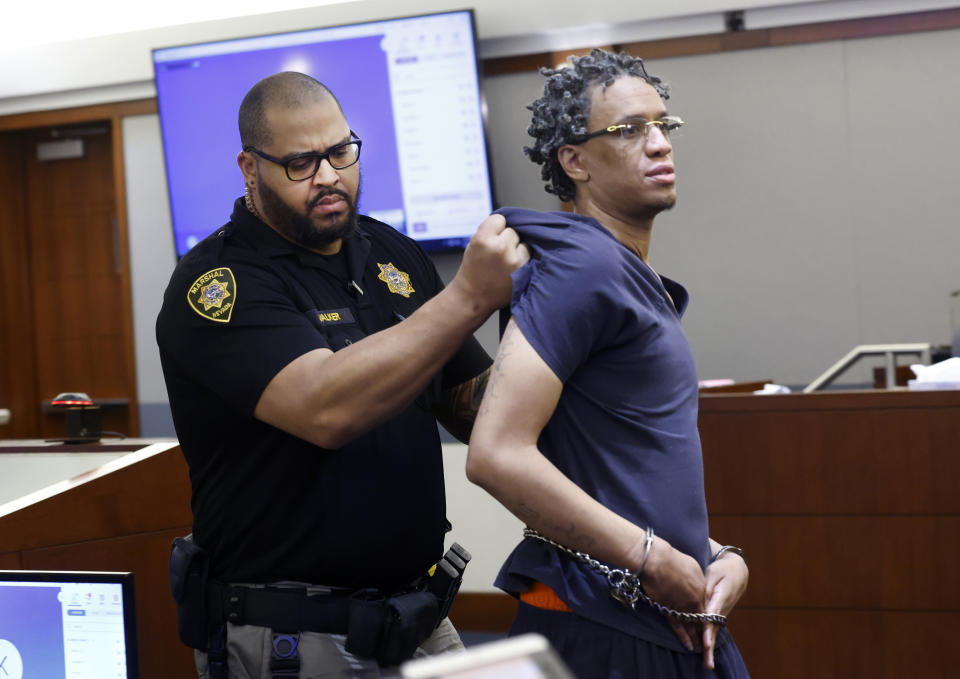 Omar Talley is led out of a courtroom after being disruptive during his sentencing at the Regional Justice Center in Las Vegas, Tuesday, Jan. 30, 2024. Talley who was convicted of fatally shooting two Northern California women near the Las Vegas Strip almost eight years ago has been sentenced to life in prison without the possibility of parole. The Las Vegas Review-Journal reports Talley was sentenced Tuesday after a judge reprimanded him for his lack of remorse. (Bizuayehu Tesfaye/Las Vegas Review-Journal via AP)