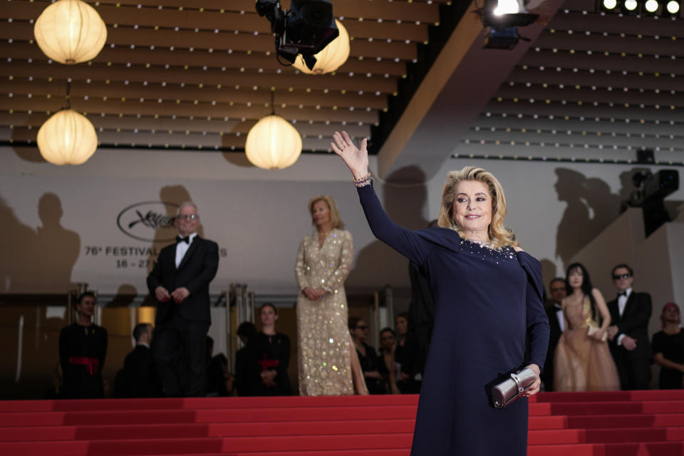 Catherine Deneuve poses for photographers upon arrival at the opening ceremony and the premiere of the film 'Jeanne du Barry' at the 76th international film festival, Cannes, southern France, Tuesday, May 16, 2023. (AP Photo/Daniel Cole)