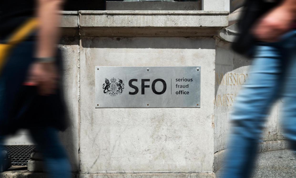 <span>Pedestrians pass the sign outside the headquarters of the Serious Fraud Office in London.</span><span>Photograph: Russell Hart/Alamy</span>