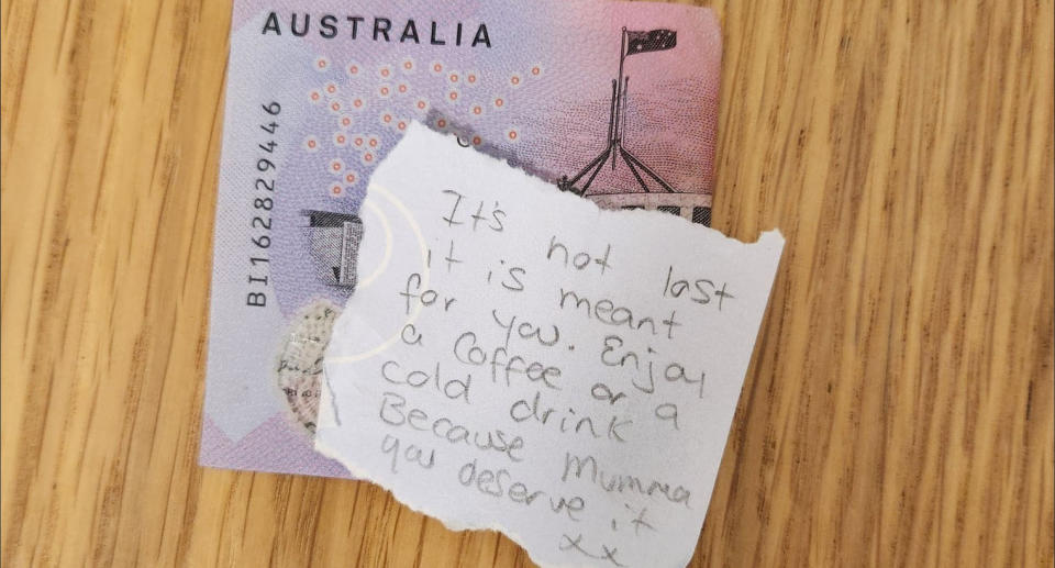 A handwritten note and $5 found in a shopping centre bathroom. 