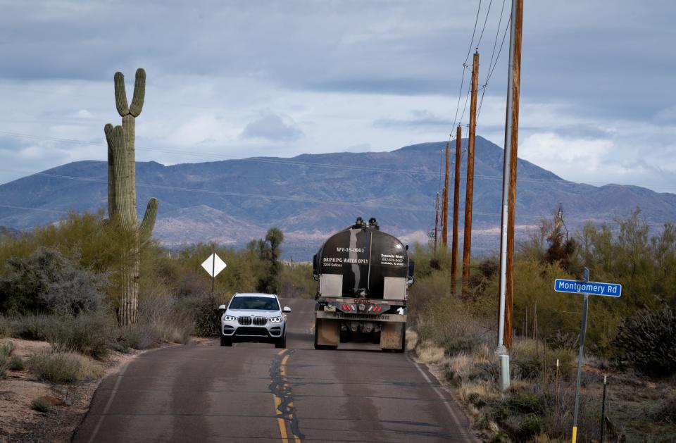 A Dynamite Water truck drives north on 136th Street while making a delivery on Dec. 29, 2022, to a client in the Rio Verde Foothills, Ariz.
