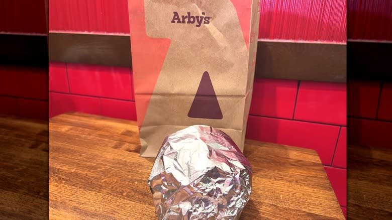 Arby's bag and wrapped burger