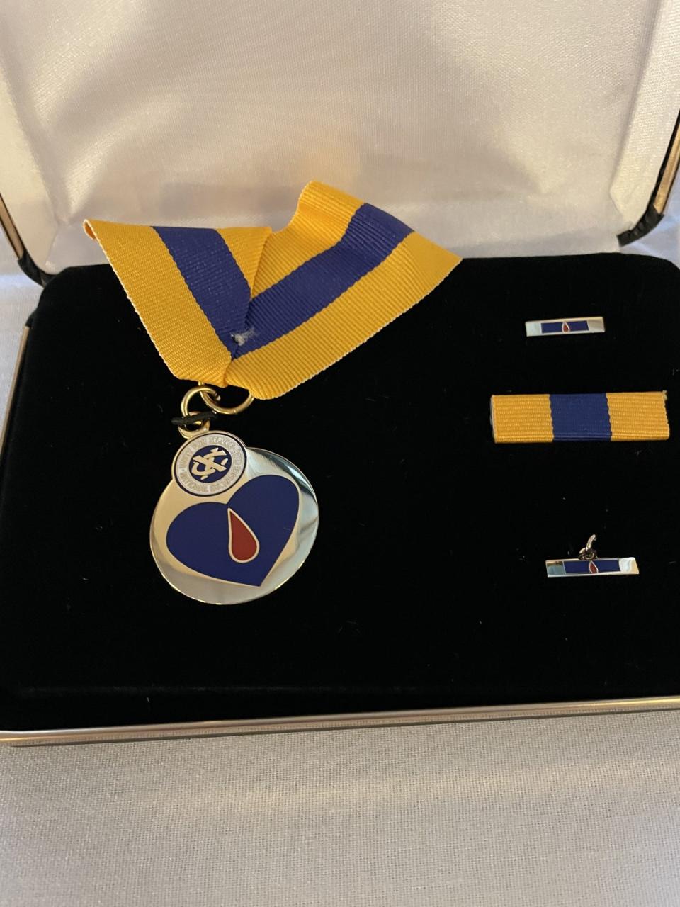 The Blue & Gold Wounded in Service Award is shown.