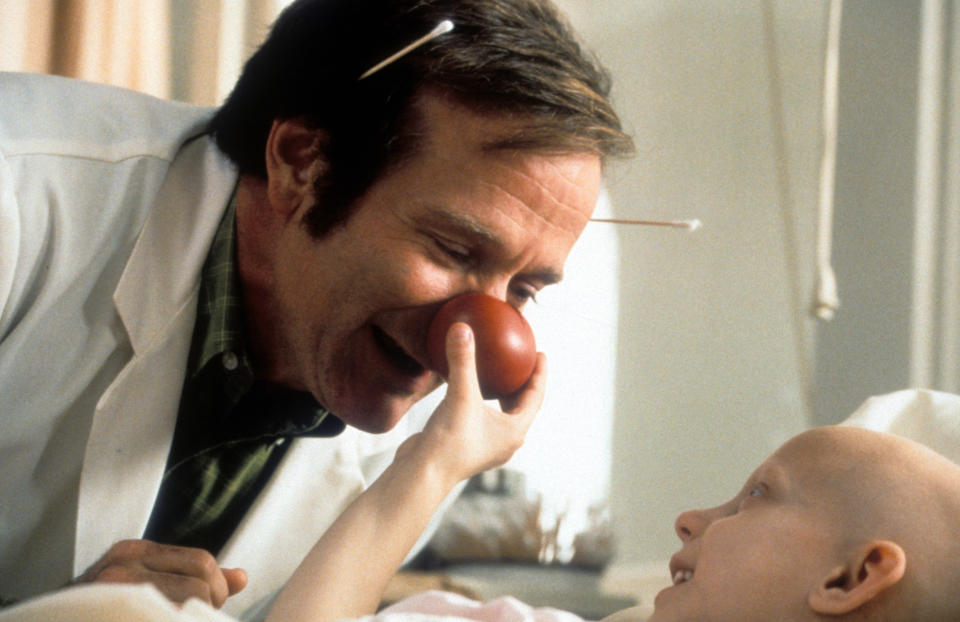 Robin Williams visits a sick child in a scene from the film 'Patch Adams', 1998. (Photo by Universal/Getty Images)