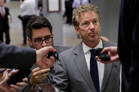 Senator Rand Paul (R-KY) speaks to reporters as he arrives for a vote on Capitol Hill in Washington, U.S., October 18, 2017. REUTERS/Joshua Roberts