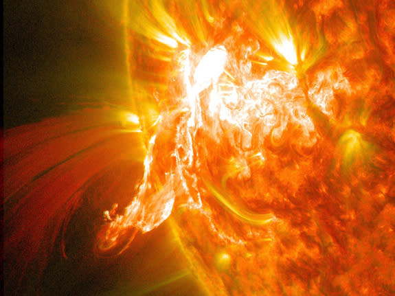 A solar flare erupts on Jan. 30, 2014, as seen by the bright flash on the left side of the sun, captured here by NASA's Solar Dynamics Observatory.