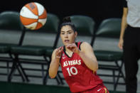 Las Vegas Aces' Kelsey Plum reaches for the ball during the first half of a WNBA basketball game against the Seattle Storm, Saturday, May 15, 2021, in Everett, Wash. (AP Photo/Elaine Thompson)