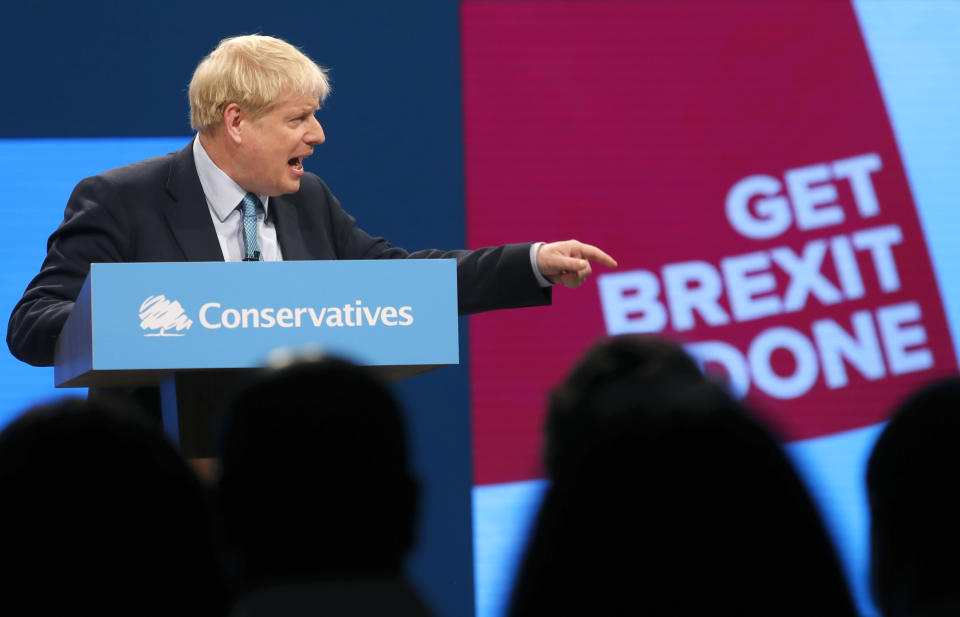 Britain's Prime Minister Boris Johnson points as he delivers his Leader's speech at the Conservative Party Conference in Manchester, England, Wednesday, Oct. 2, 2019. Britain's ruling Conservative Party is holding their annual party conference. (AP Photo/Frank Augstein)