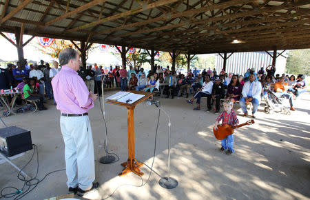 Democratic Alabama U.S. Senate candidate Doug Jones addresses supporters while campaigning at an outdoor festival in Grove Hill, Alabama, U.S. on November 4, 2017. REUTERS/Mike Kittrell